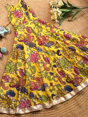 Yellow tussar silk gown for girls features a vibrant pen kalamkari floral print 2