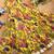 Yellow tussar silk gown for girls features a vibrant pen kalamkari floral print