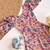 Light pink floral flare dress with puff sleeves and a round neckline