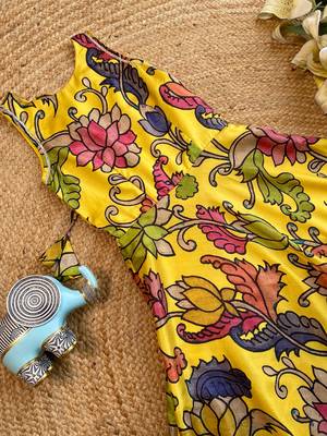 Yellow tussar silk gown for girls features a vibrant pen kalamkari floral print 4