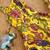Yellow tussar silk gown for girls features a vibrant pen kalamkari floral print