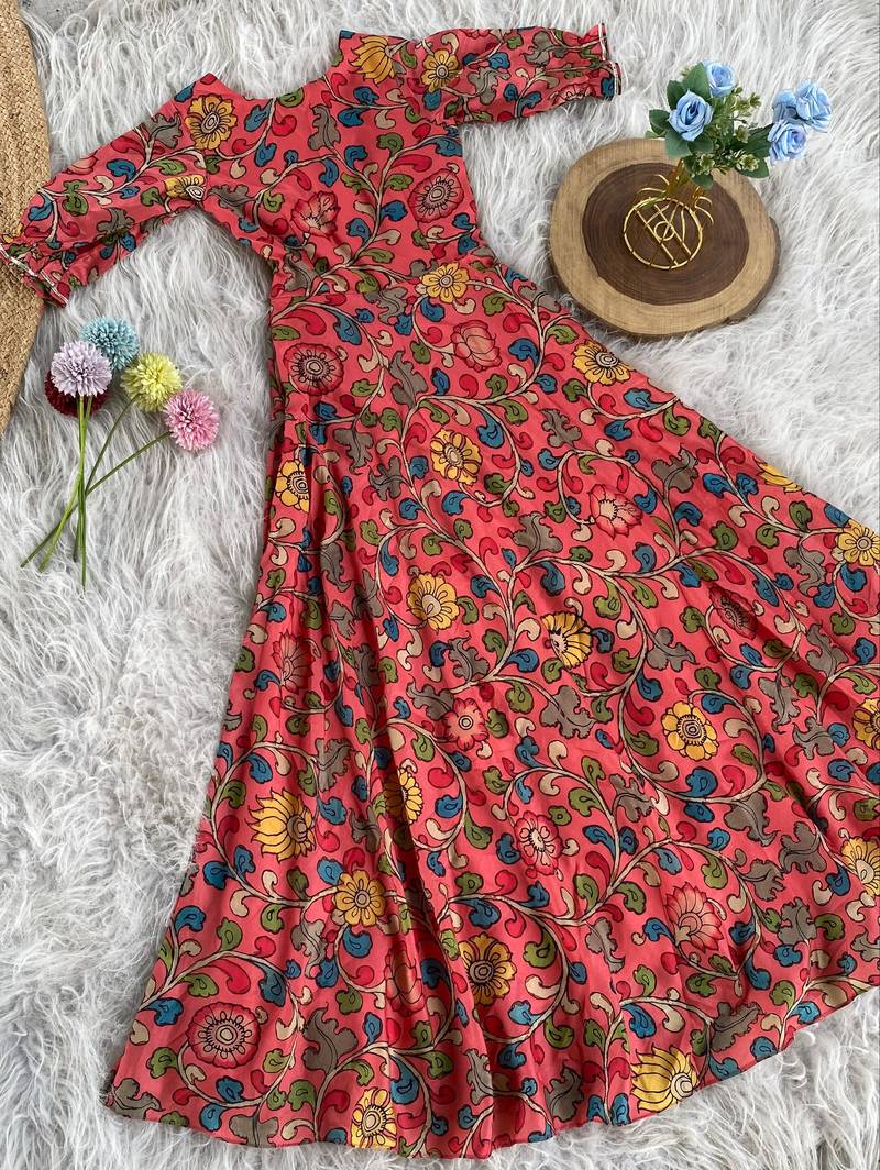 This flared penkalamkari dress with gota detailing and a front tie-up