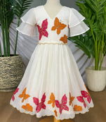 Dreamy girls gown featuring hand-painted butterflies and flared sleeves