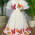 Dreamy girls gown featuring hand-painted butterflies and flared sleeves