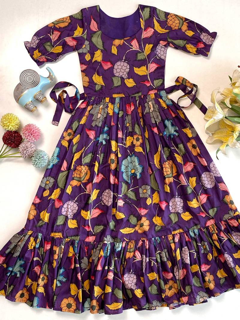 Purple tussar silk gown for girls features a vibrant pen kalamkari floral print