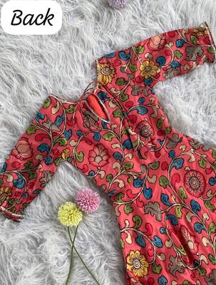 This flared penkalamkari dress with gota detailing and a front tie-up 2