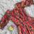 This flared penkalamkari dress with gota detailing and a front tie-up