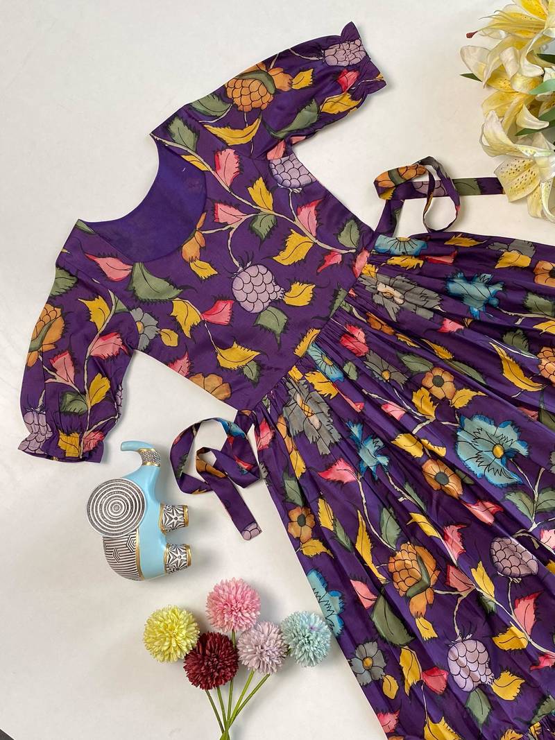 Purple tussar silk gown for girls features a vibrant pen kalamkari floral print