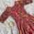 This flared penkalamkari dress with gota detailing and a front tie-up