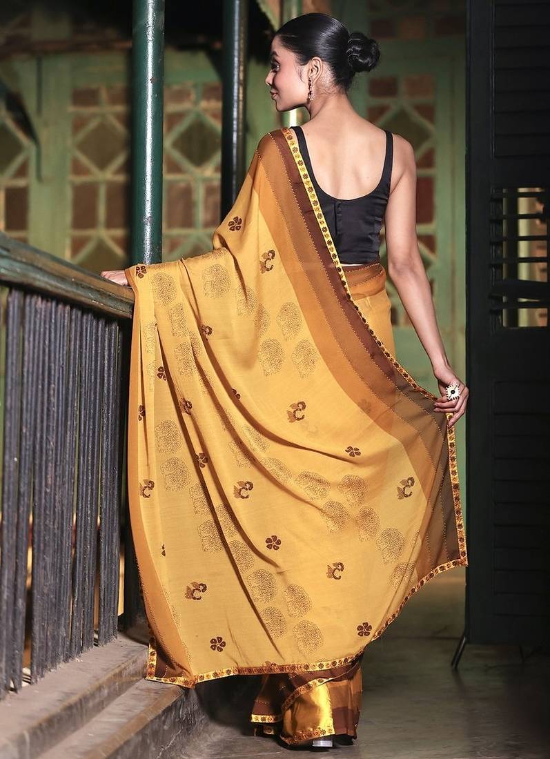 Soft moss crepe mustard printed saree with blouse piece