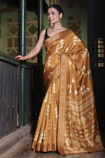 Mustard abstract print soft silk saree with zari border with blouse piece