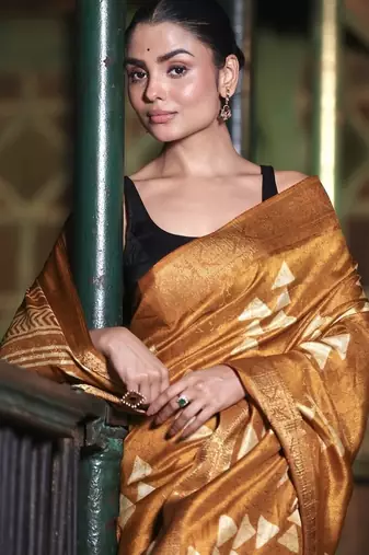 Mustard abstract print soft silk saree with zari border with blouse piece