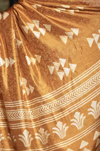 Mustard abstract print soft silk saree with zari border with blouse piece