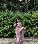 Pink striped linen blend saree with blouse piece