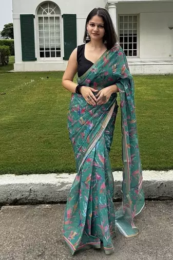 Green floral linen blend saree with blouse piece