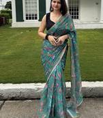 Green floral linen blend saree with blouse piece