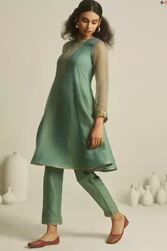 Sea green chiffon kurta set with sheer sleeves and hand embellished detailing
