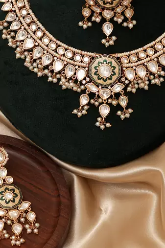 Gold plated white stones kundan necklace set with maang tikka