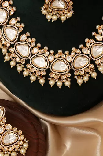 Gold plated white stones polki kundan necklace set with maang tikka