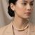 Gold plated golden pill choker neckpiece