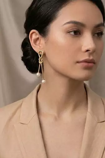 Gold plated gilded knot dangler earrings