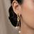 Gold plated gilded knot dangler earrings