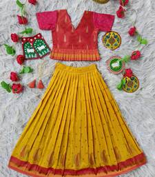 Beautiful ethnic skirt and top set featuring an elegant daaman design with intricate woven motifs
