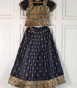 Black ethnic skirt and top set featuring an elegant border design with intricate woven motifs