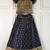 Black ethnic skirt and top set featuring an elegant border design with intricate woven motifs