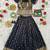 Black ethnic skirt and top set featuring an elegant border design with intricate woven motifs
