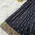 Black ethnic skirt and top set featuring an elegant border design with intricate woven motifs