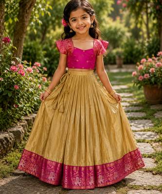Gold silk tissue skirt paired with a soft silk top, adorned with a contrast pink border 1