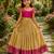 Gold silk tissue skirt paired with a soft silk top, adorned with a contrast pink border