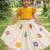 cottan multi-floral print top paired with a matching floral skirt