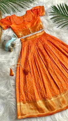 Girls orange bandhani skirt and top set with radha krishna motif back design 1