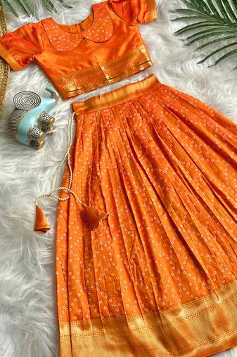 Girls orange bandhani skirt and top set with radha krishna motif back design