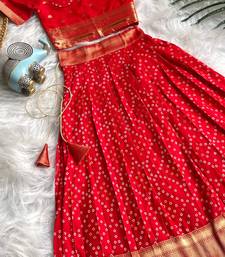 Girls red bandhani skirt and top set with radha krishna motif back design