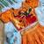 Girls orange bandhani skirt and top set with radha krishna motif back design