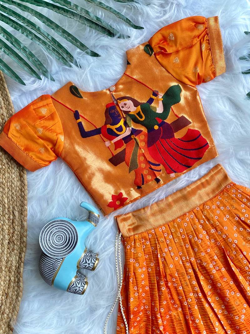 Girls orange bandhani skirt and top set with radha krishna motif back design