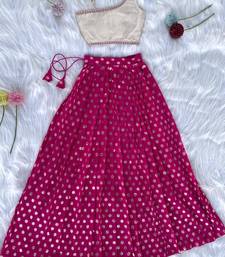 Pink one-shoulder solid crop top with polka dot flared lehenga for girls