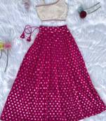 Pink one-shoulder solid crop top with polka dot flared lehenga for girls