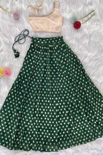 Green one-shoulder solid crop top with polka dot flared lehenga for girls
