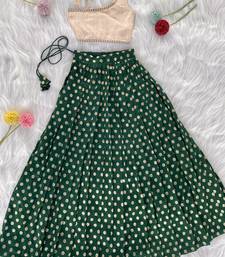Green one-shoulder solid crop top with polka dot flared lehenga for girls
