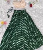 Green one-shoulder solid crop top with polka dot flared lehenga for girls