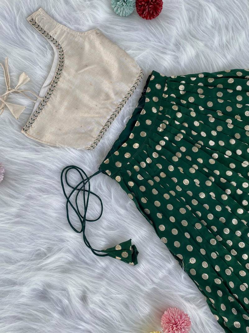 Green one-shoulder solid crop top with polka dot flared lehenga for girls