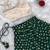 Green one-shoulder solid crop top with polka dot flared lehenga for girls