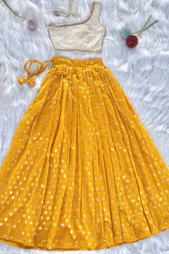 Yellow one-shoulder solid crop top with polka dot flared lehenga for girls