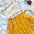 Yellow one-shoulder solid crop top with polka dot flared lehenga for girls