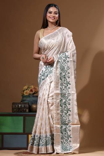 Off-white banarasi silk (jacquard) with computer embroidery saree with blouse piece