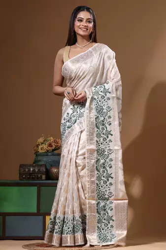 Off-white banarasi silk (jacquard) with computer embroidery saree with blouse piece